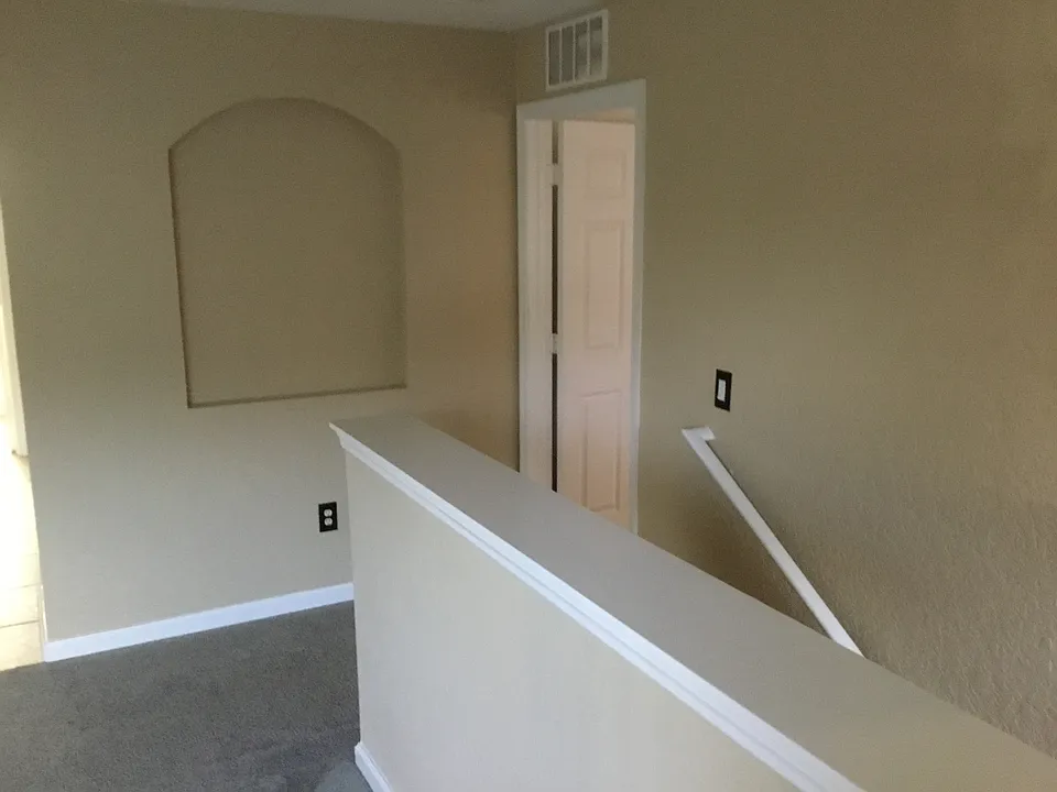Top of stairway - office to right