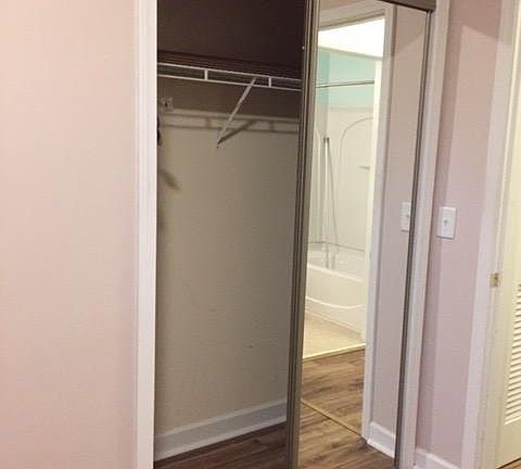 bedroom with mirrored closet