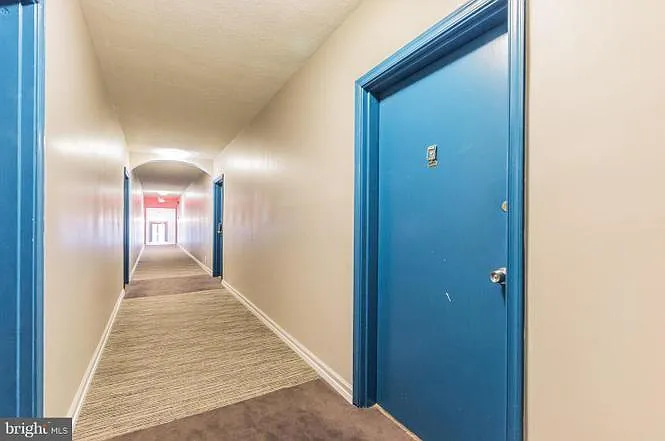 Building hallway- condo is the corner unit on the top floor