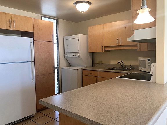 Washer/dryer tucked away it the unit.