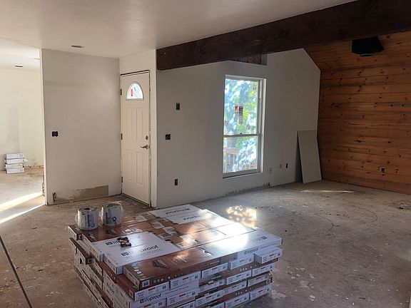 Living area and front door to private deck
