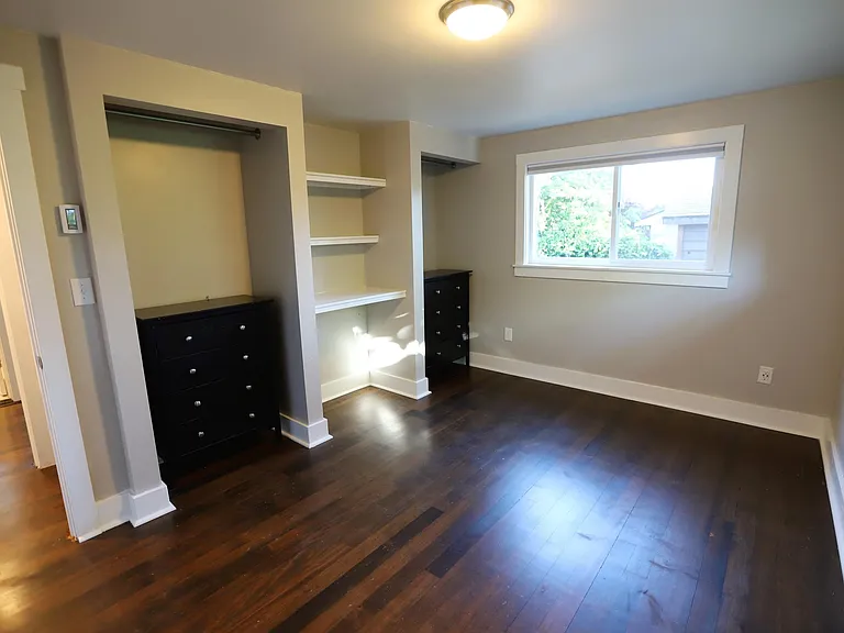 Bed 2 shelving and closet areas.