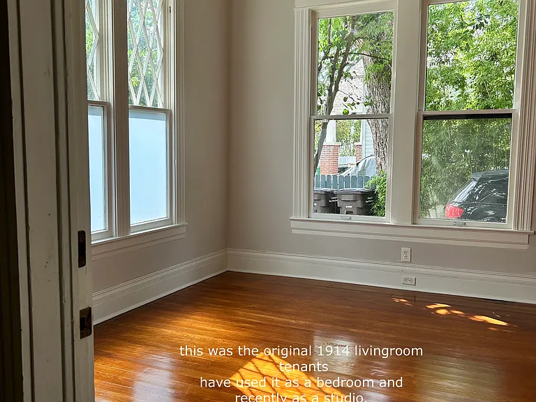 13x15 "bedroom with very efficient a/c and heat the windows to the side open and they will have curtain rods. View from the foyer entry.