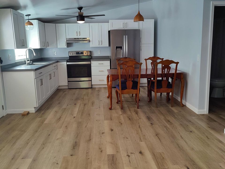 Kitchen with new range and refrigerator.