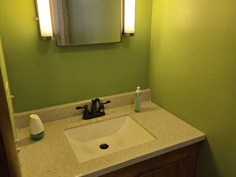 1/2 bath off kitchen / garage area
