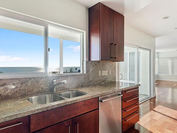 Kitchen Area + Sliding Door Panoramic Ocean Views from Balcony