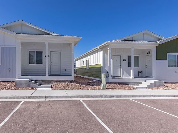 Explore the inviting exterior of this modern duplex, perfect for comfortable living.