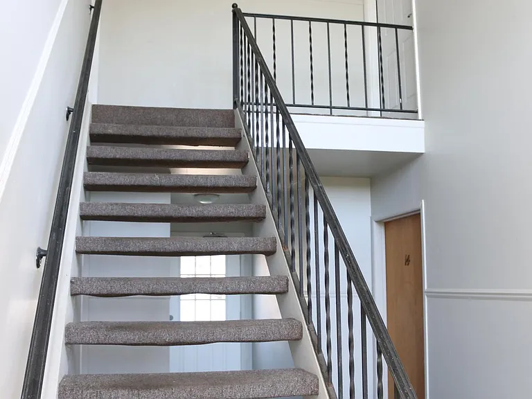 Entrance to Apartment 16 is up the stairs and to the right.