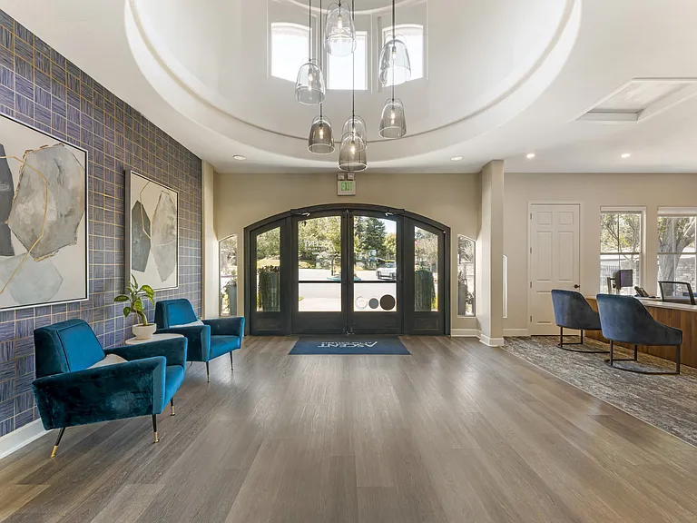 The entrance to the leasing office and clubhouse is warm and welcoming, designed to make all residents and guests feel at home the moment they arrive at Ascent at the Galleria.