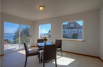Dining Room off of the kitchen with sliding glass door which opens to deck with panoramic view of the Puget Sound.