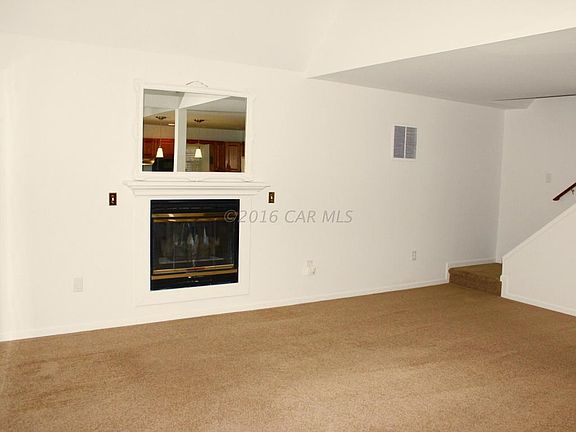 Living room to stairway with gas FP