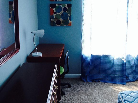 Bedroom 1 - dresser, desk, chair, bed, closet, curtains