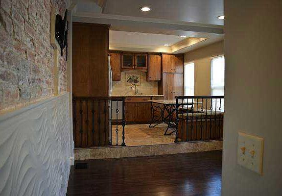 View of kitchen and living room from hallway