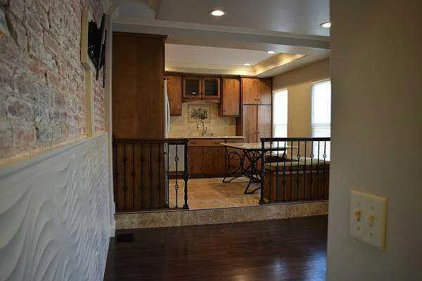 View of kitchen and living room from hallway