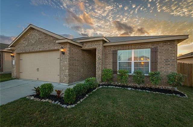 Recent landscaping boasting a simple but elegant curbside appeal.