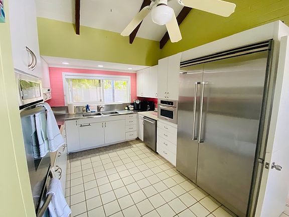 Kitchen with extra large fridge dishwasher + everything you need to make wonderful meals at home