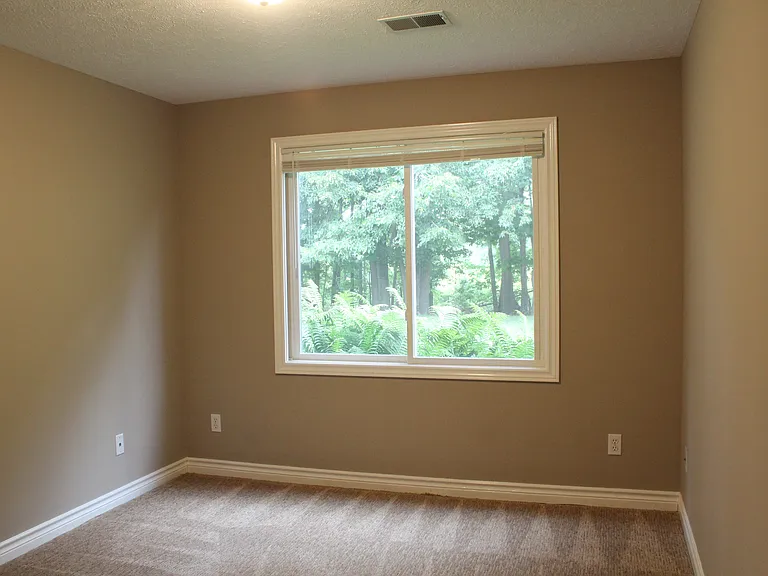 Bedroom #3 in lower level with backyard view