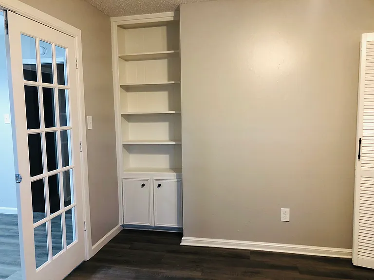 4th bed or office. French doors lock for privacy. Has closet and book shelves.