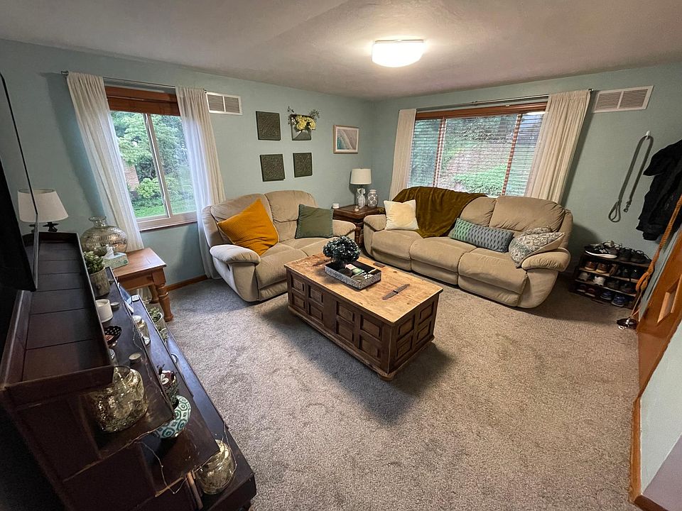Living Room, large windows provide natural light and fresh air.