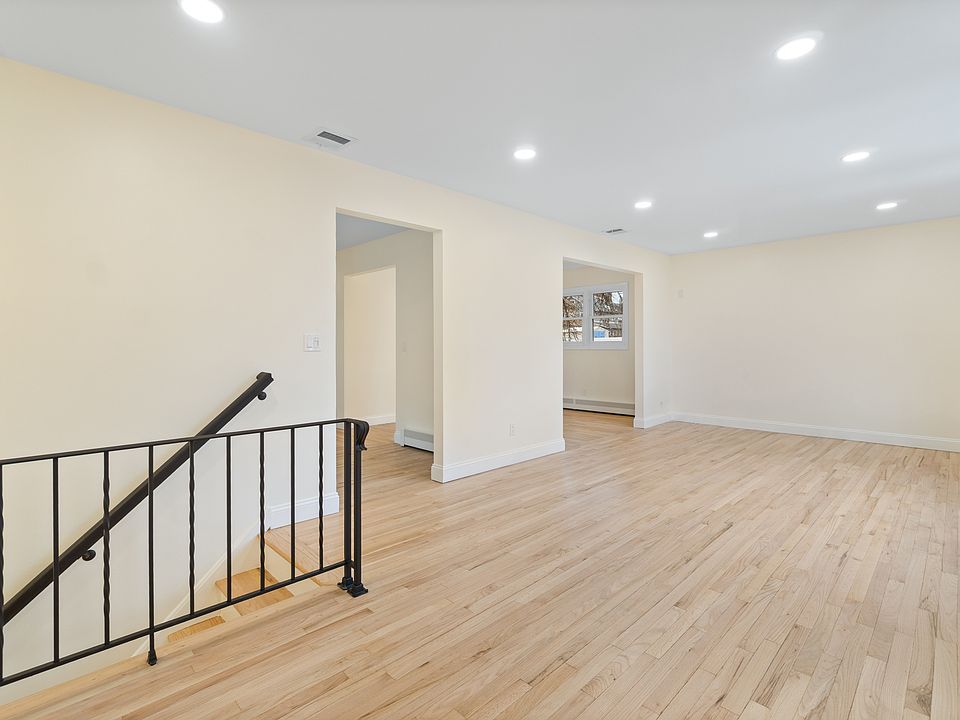Living room with view of kitchen and dining room entrance