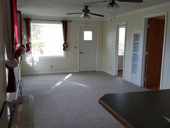 open plan living room flows out from kitchen area