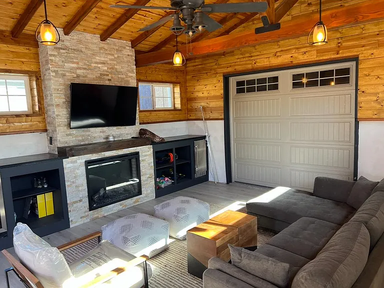 Bonus room, indoor/outdoor with fireplace, mini fridge, freezer and TV