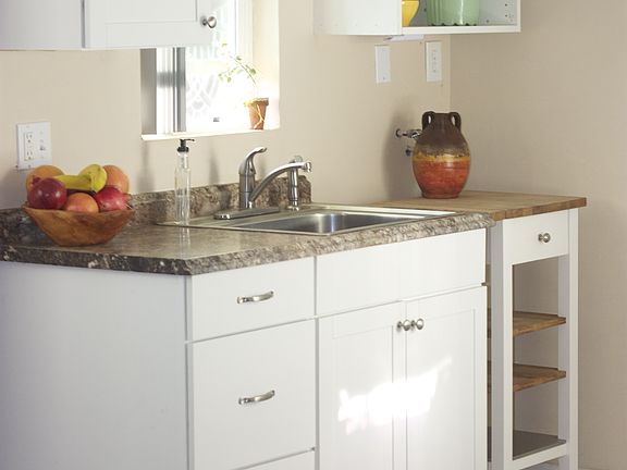 Large sink with lots of cabinet storage and a small W/D hook-up if needed.