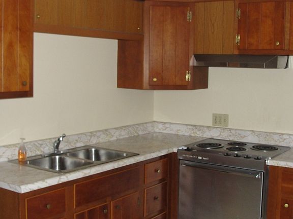 Kitchen w stainless steel sink and Electric stove/oven