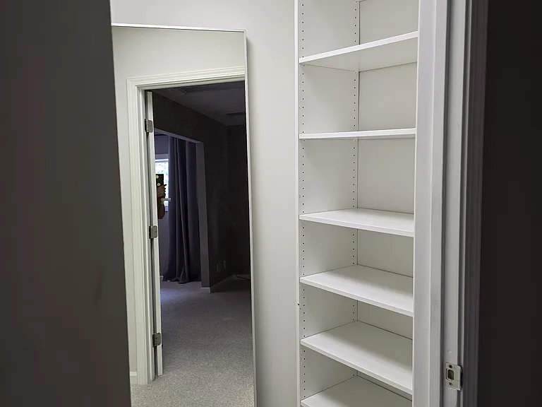 Shelves on right side of walk-in closet from bedroom.