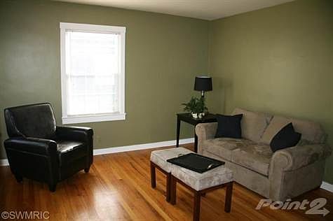 Beautifully refinished hardwood floors in the living room greet you as you enter this beautiful home.
