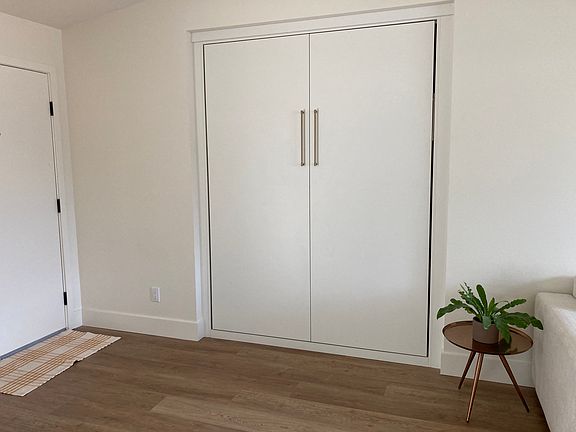 Brand new California Closets custom queen Murphy bed.