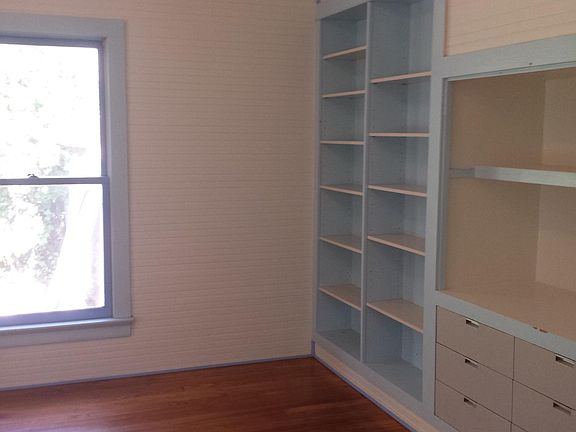 One bedroom with built in bookcases, great storage