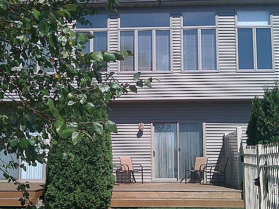 Private deck at the back of the two-story condo.