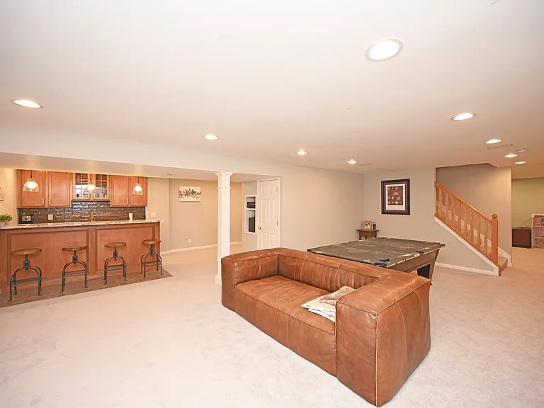 Newly remodeled basement with brand new carpeting and bar