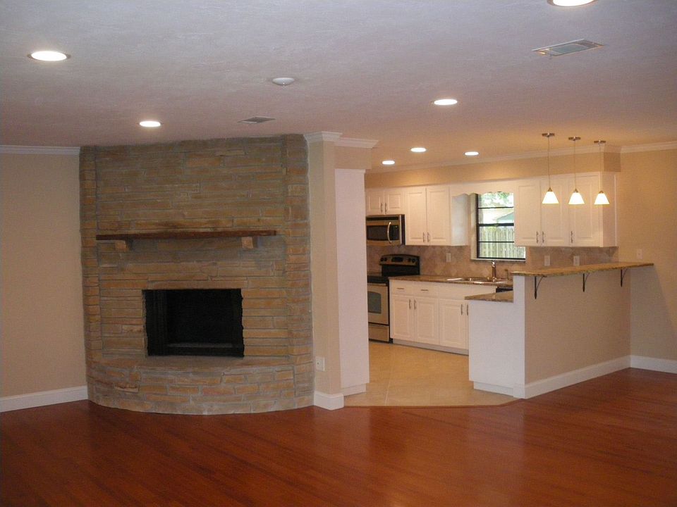 Open Floor Plan with Corner Stone Fireplace