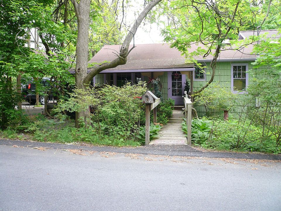 Front of the house with driveway on the left
