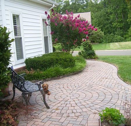 house surronded by beautiful walkway and pation