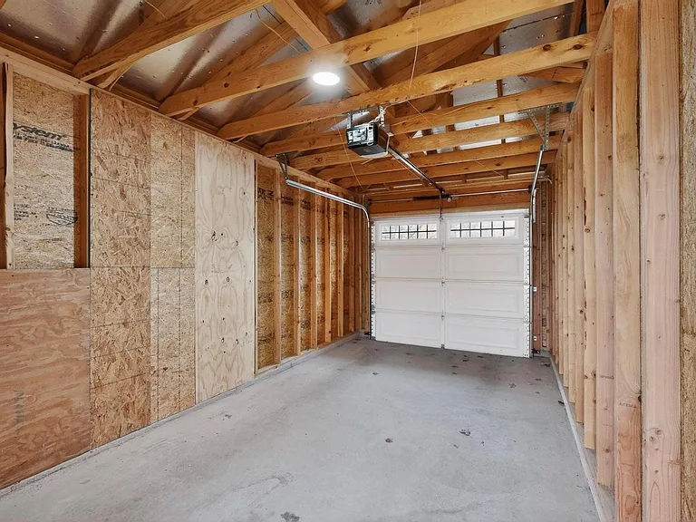 A garage featuring wooden walls, showcasing a rustic and natural aesthetic.