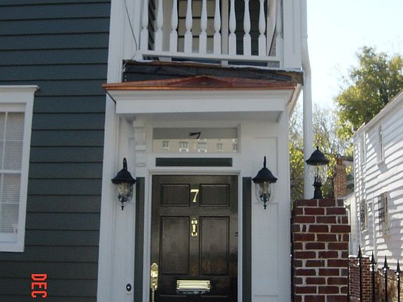 Front entrance and 2nd story porch with copper awning