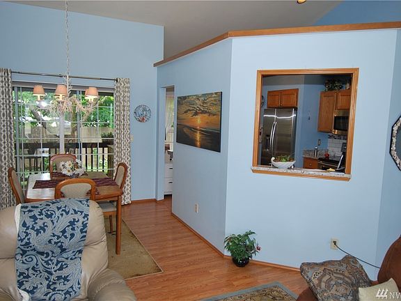 Kitchen pass threw window with dining room next to the living room. 