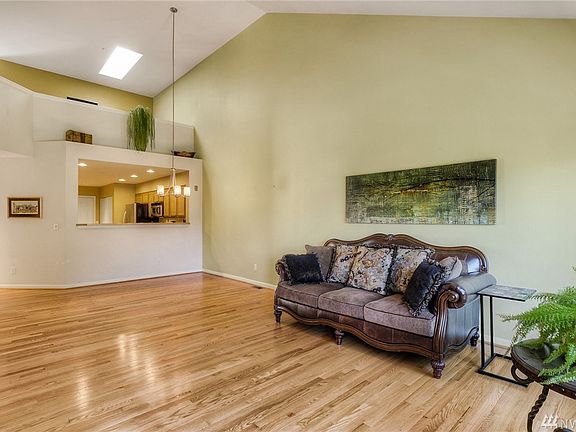Vaulted ceilings and silhouette window in kitchen create a more open living space.