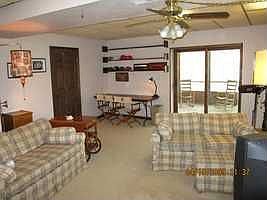 Rec room has direct access to screened porch & storage room. Wood stove