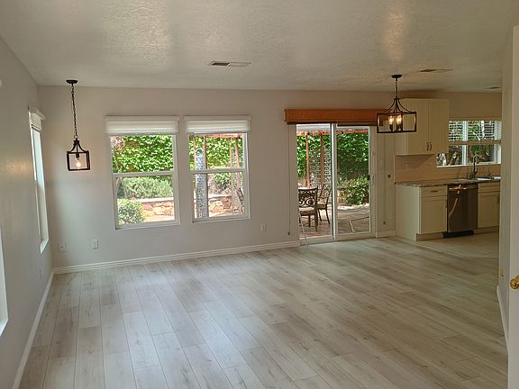 Living room from front door. Pull shades on all 1st floor windows and above back sliding door.