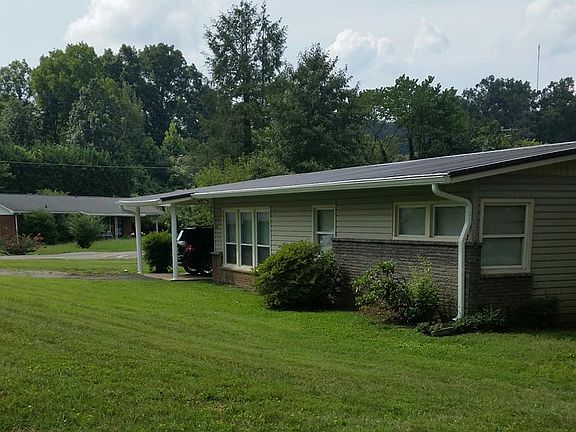 Covered carport, metal roof, corner lot with nice size yard