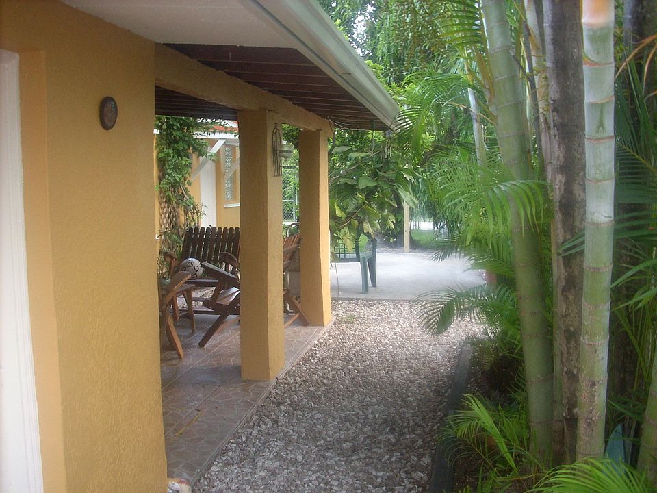 Side Yard with Great Outdoor Living leading to a wonderful, large backyard
