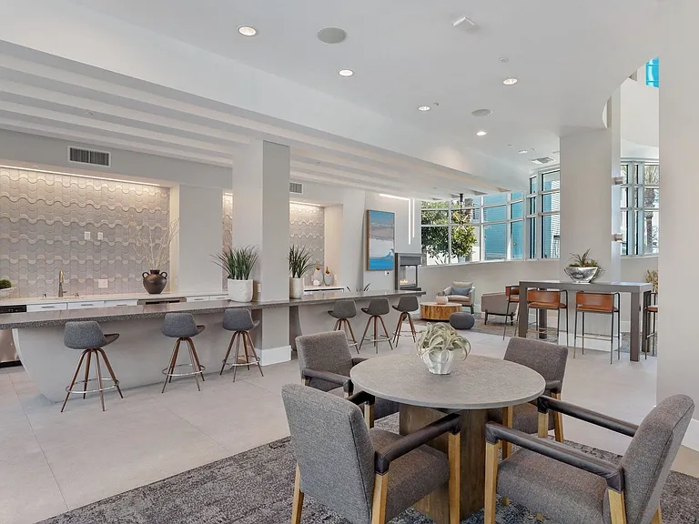 Clubroom lounge with cozy seating, a pause between meetings or calls