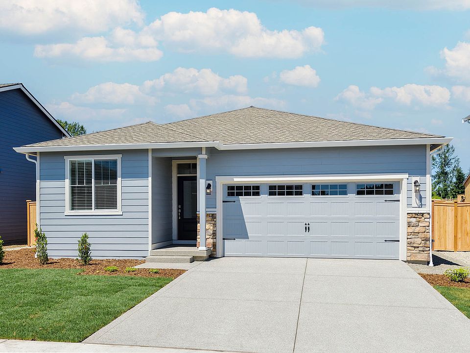 Beautiful single story home at Prairie Creek Farms with siding and front yard landscaping