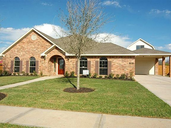 Another view of the front of this home.  Beautiful brick exterior with landscaping.