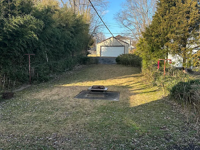 backyard with parking pad - yard fenced on three sides