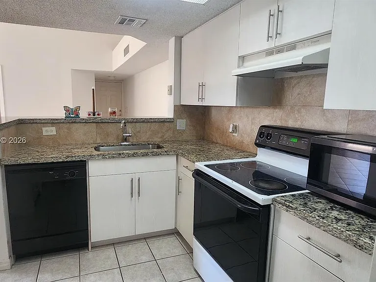 5011 Wiles Rd #306 — Photo 6